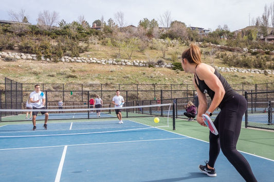 A group of pickleball players show off their beginner pickleball tips they have learned.