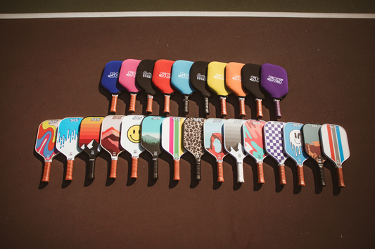 Full line-up of pickleball paddles from Salted City Sports. Pickleball paddle being cleaned with SCS. Removes dirt and grime effectively. Maintains paddle's performance.
