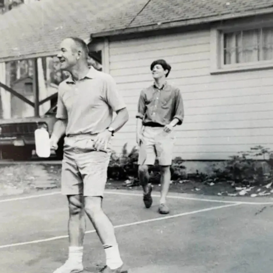 Joel Pritchard the founder of pickleball playing pickleball on a court