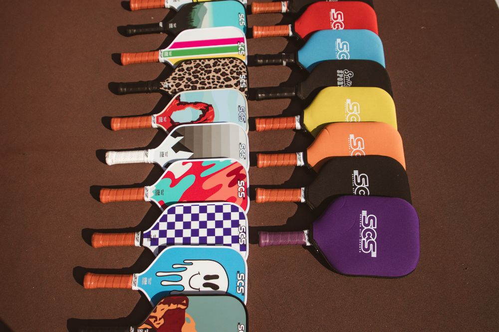 A variety of colorful and fun pickleball paddles from Salted City Sports