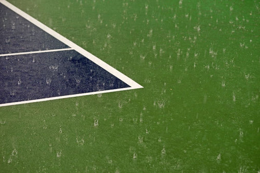 A Pickleball court getting rained on